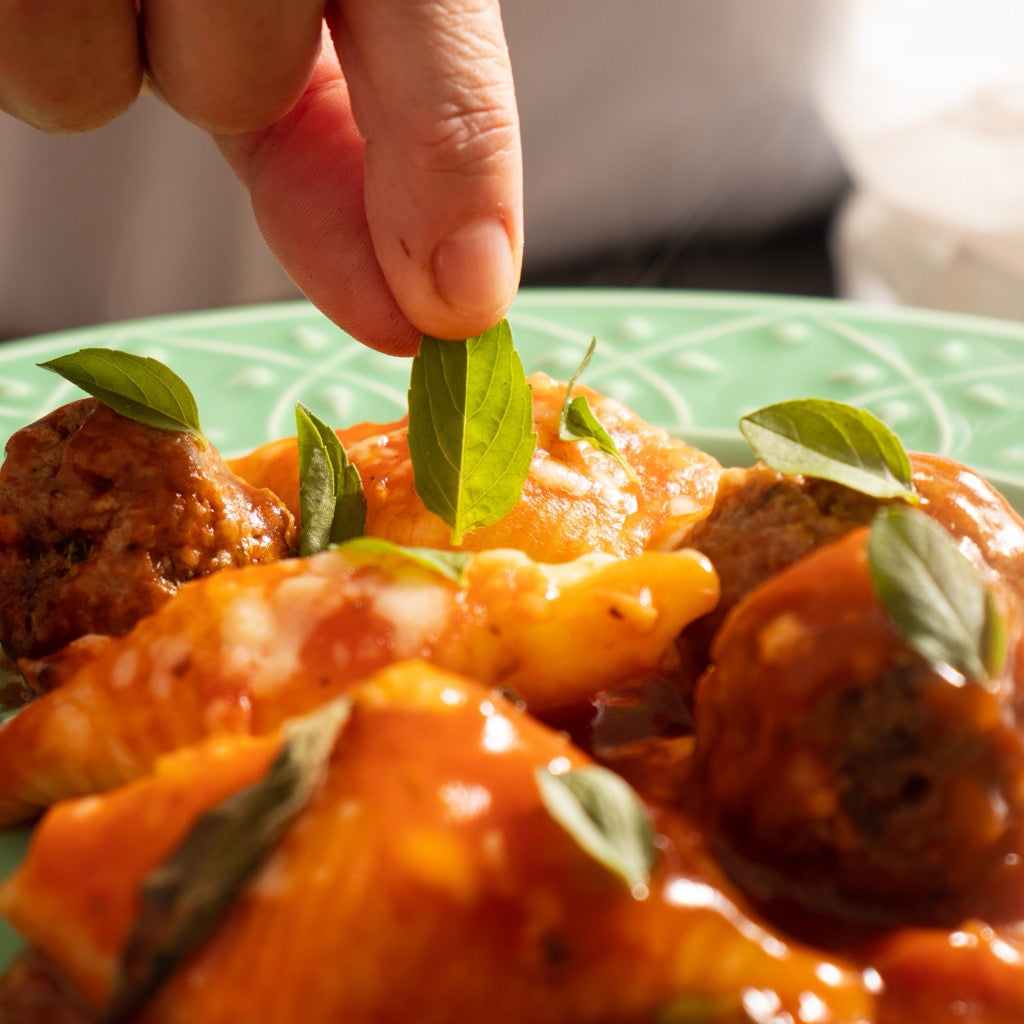 Conchiglioni 4 Queijos servido no prato